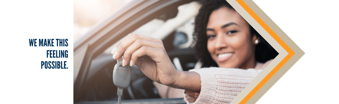 "A woman sitting in a car, holding up a car key and smiling. Text on the left reads 'We make this feeling possible.'"