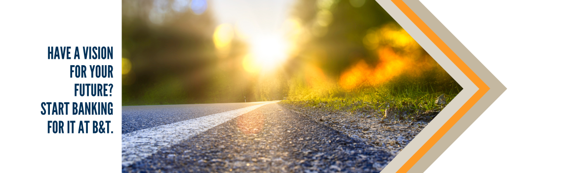 "A picturesque road stretching into the horizon, bathed in the golden light of the setting sun. Text on the left reads 'Have a vision for your future? Start banking for it at B&T.'"